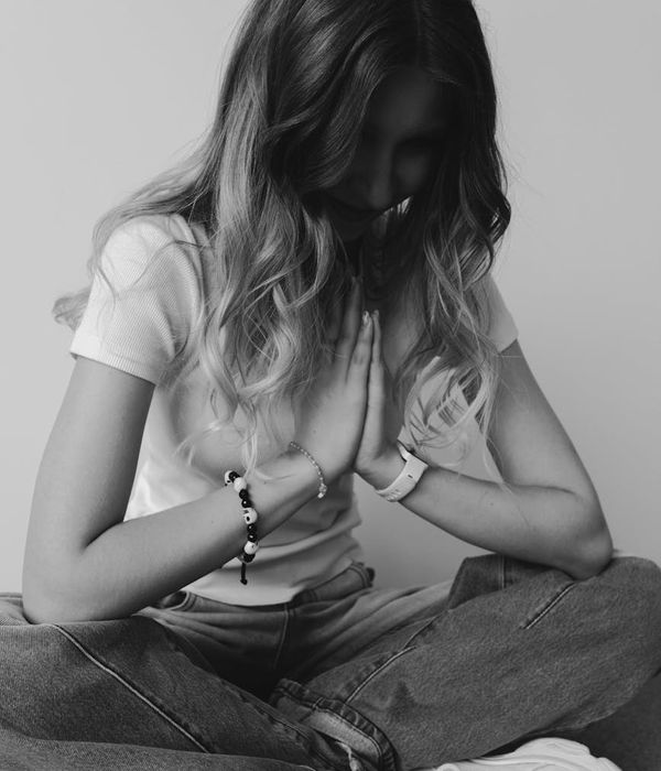 Woman in a calm yoga pose, embodying balance and serenity.
